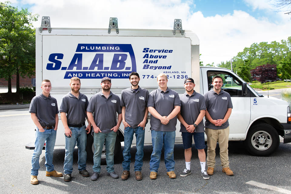 SAAB Plumbing and Heating Crew In Front Of Work Van